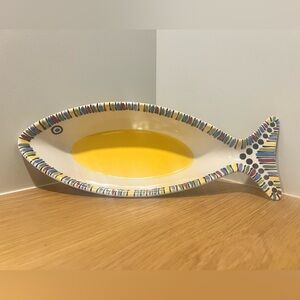 Multi-colored fish-shaped bowl.